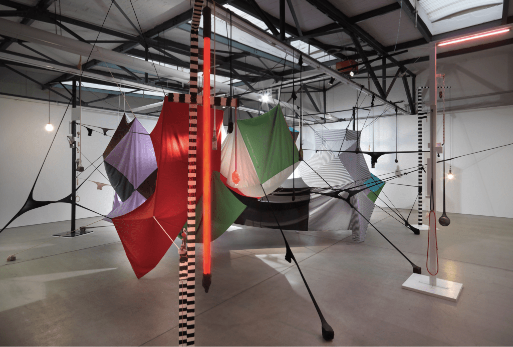 Square Cloud Compound#2, 2010 Fabric, stocking, pins, beer, champagne, vodka, ceramics, found things, wood, rocks and lights Dimensions variable Image courtesy of the artist and Roslyn Oxley9 Gallery, Sydney