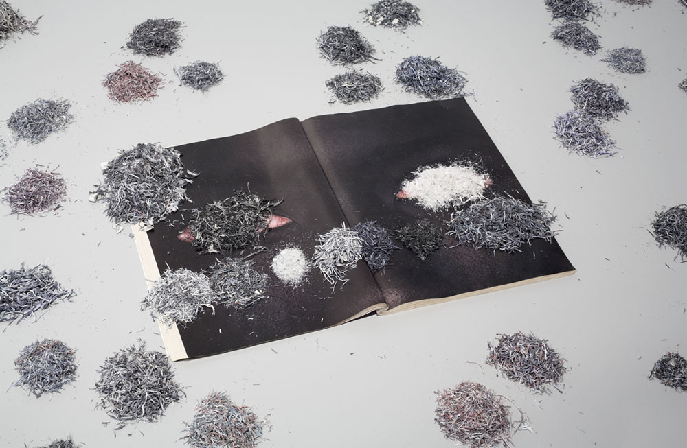 vacant bazaar (provisional legend), 1999-2010 installation of nine erased magazines with rubber erasings#2